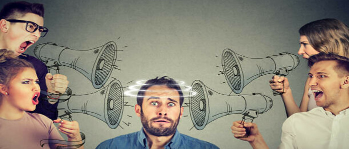Common Mistakes To Avoid With Affiliate Marketing image 2 man overwhelmed by several megaphones directed toward him make xtra money online