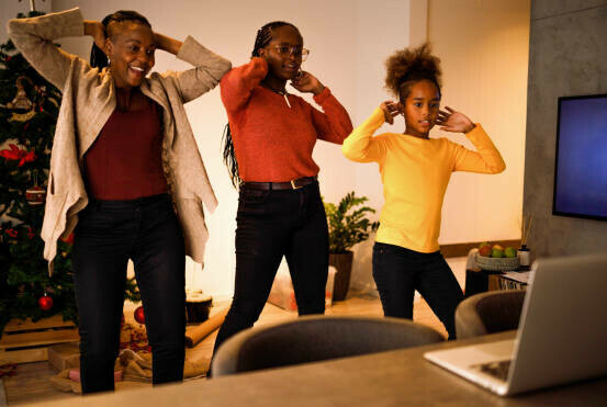 How To Make Money On Tiktok A Beginners Guide image 1 2 women and a child standing in front of open laptop doing a tiktok dance make xtra money online