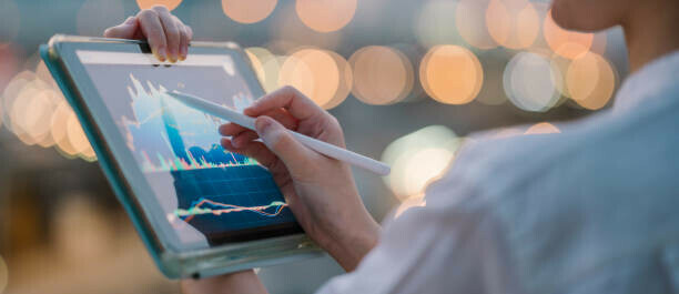 How To Make Money On Tiktok A Beginners Guide image 3 woman holding a tablet monitoring statistics on the screen make xtra money online